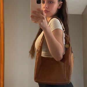 brown leather hobo bag with gold hardware